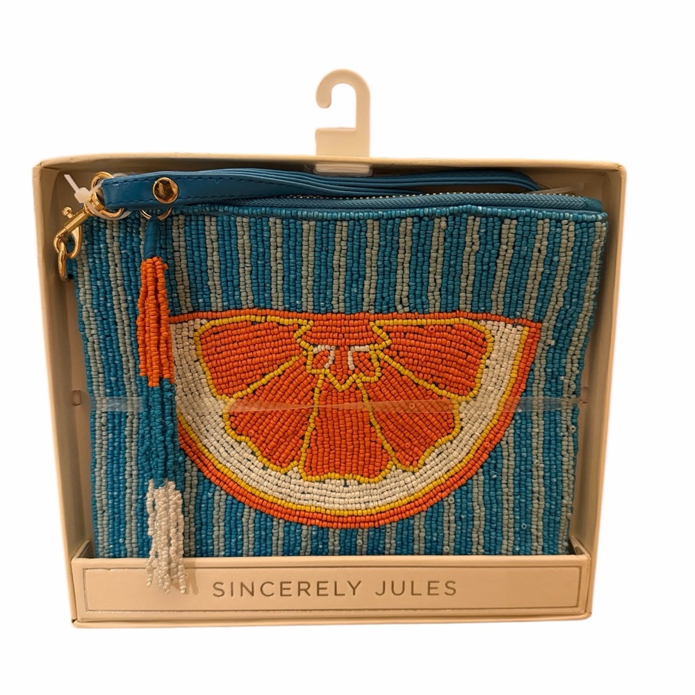 Sincerely Jules Beaded Orange Slice on blue & gray background.